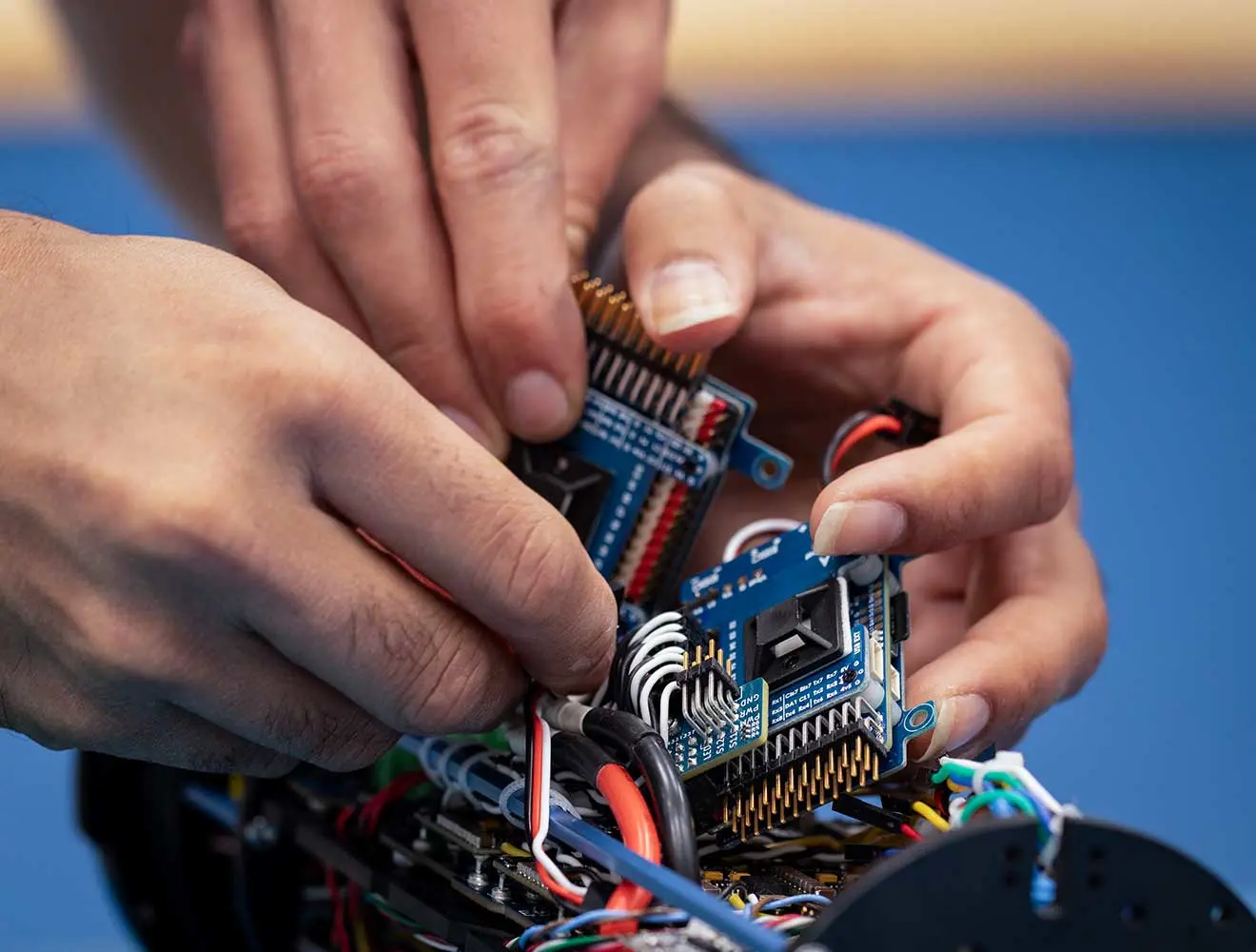 Hands assembling circuit boards