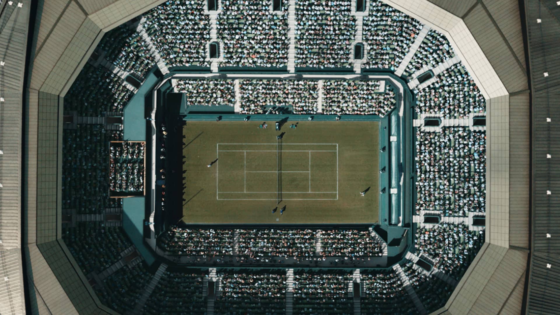 Packed stadium for tennis match.
