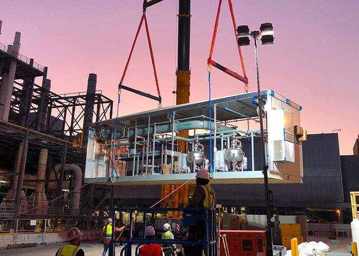 Prefab building component being lifted into place