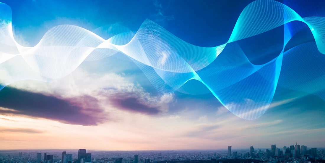 Colorful sky over city skyline with vector overlay