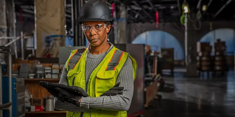 female construction worker using a tablet