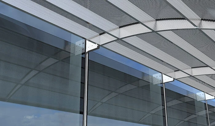 This custom solar-control shade on a curtainwall maximizes daylighting and minimizes glare. 