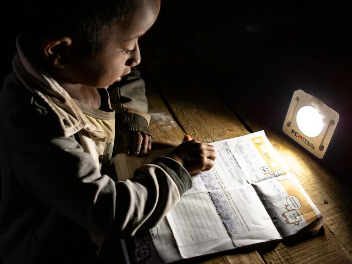A child studies using SolarBuddy, Madagascar, 2018. 