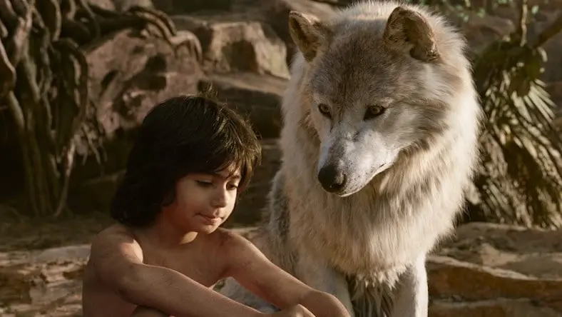 Still of boy and wolf from Jungle Book remake