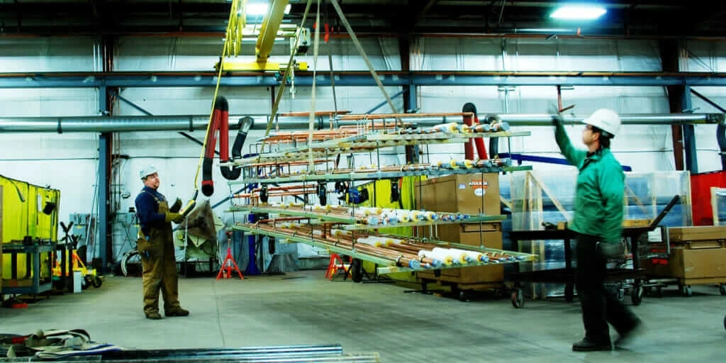 two construction workers in a warehouse