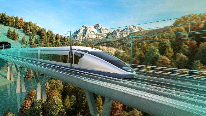 A high speed train on an elevated track  in a mountainous setting