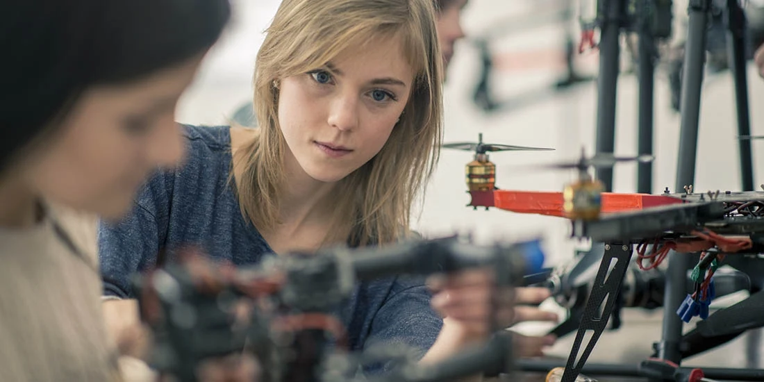 A woman working on a drone.