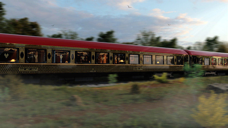 A luxury train speeds through the French countryside