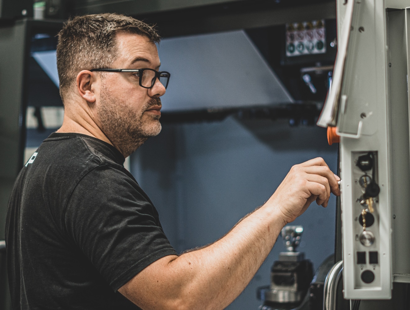 Pembree employee using a CNC machine