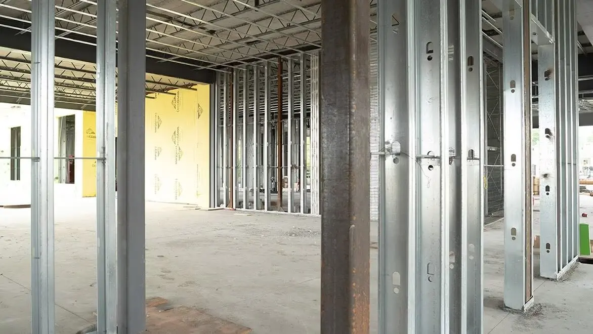 A building’s internal wall frames are built from steel.