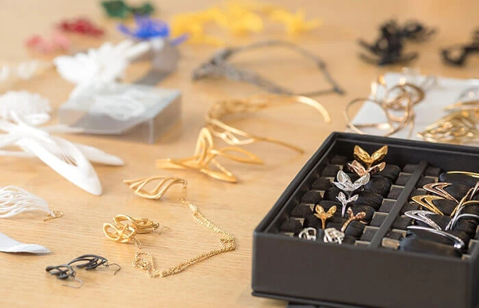 Collection of metal and 3D printed jewelry designed by Ai Sato