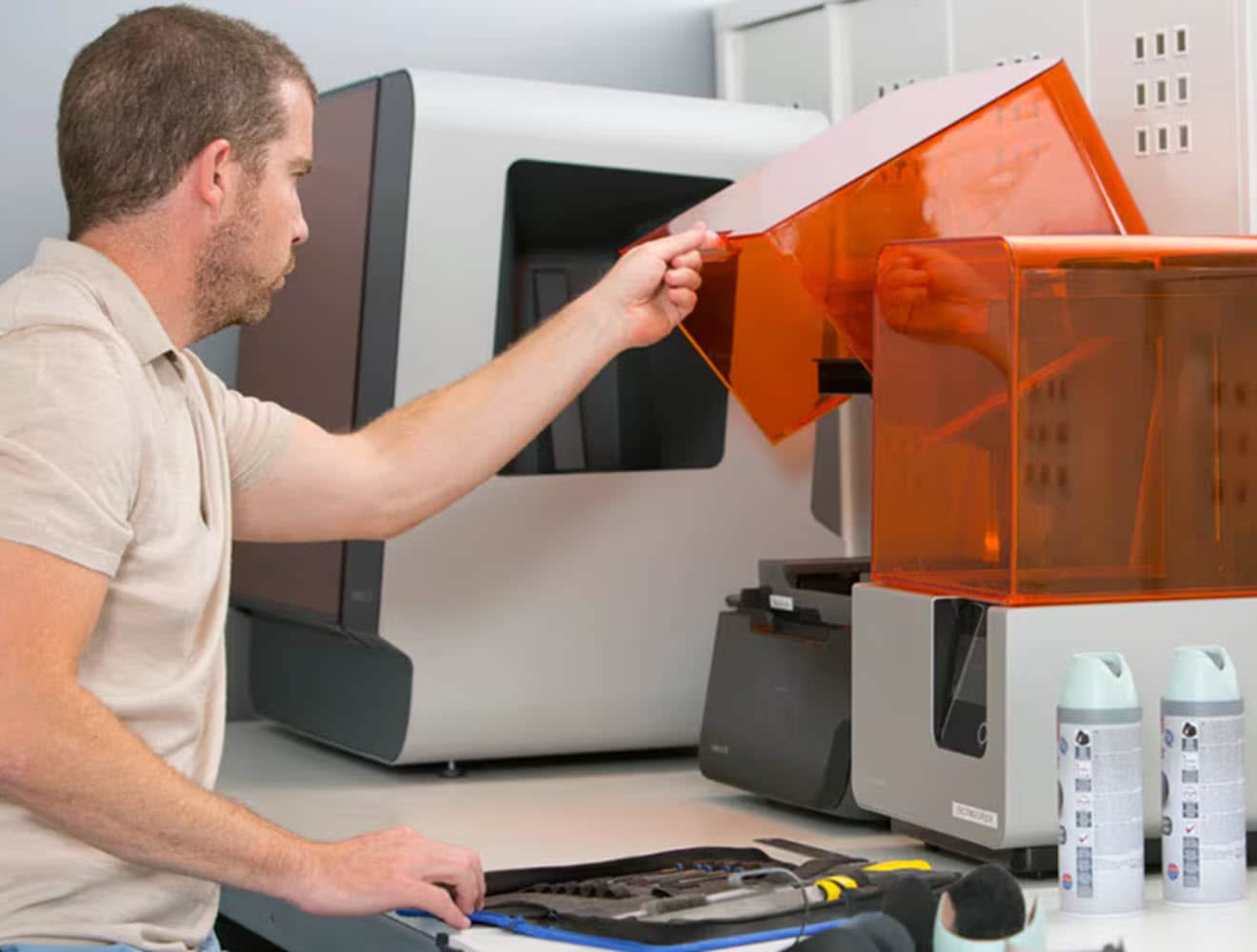 Man using 3D printer.