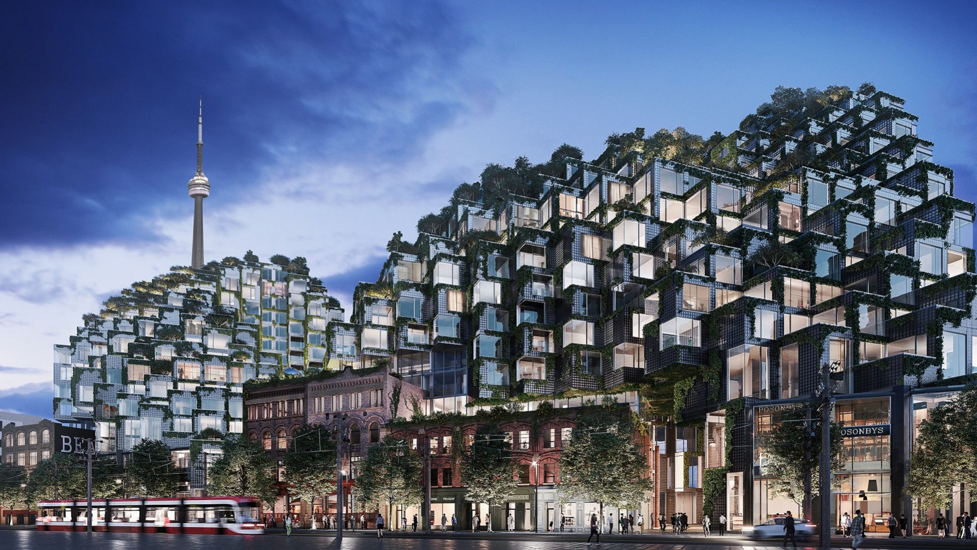 A nighttime view of KING Toronto highlights the geometric shapes of the building's individual residential units.