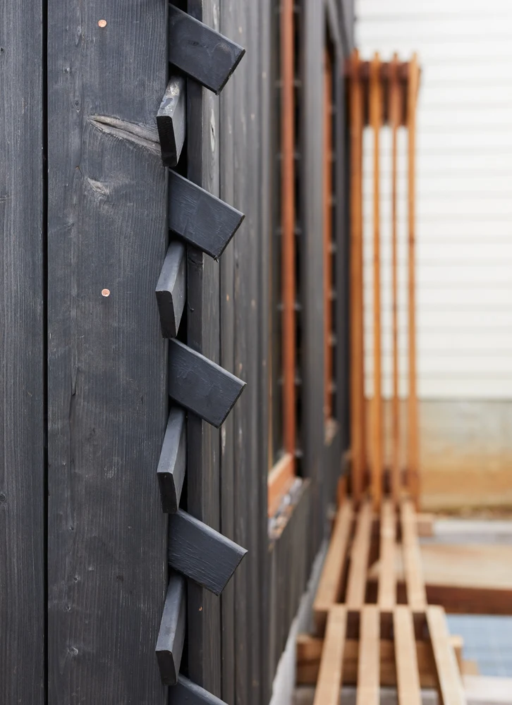 Close up black exterior cladding of Grass House