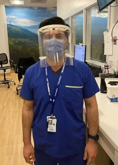 Hospital worker wears apil face shield