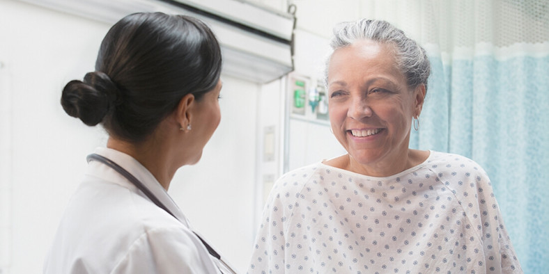 Older woman smiling in doctor consultation