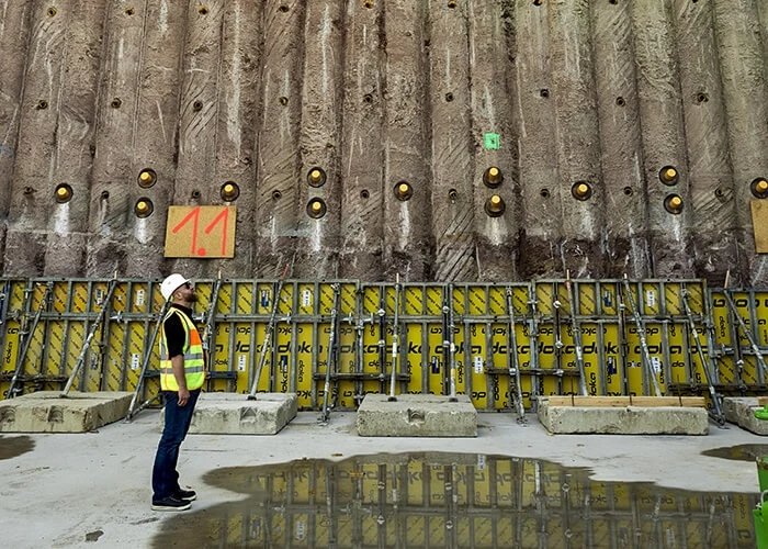 A man in a safety vest and hard cat on a construction site in Germany