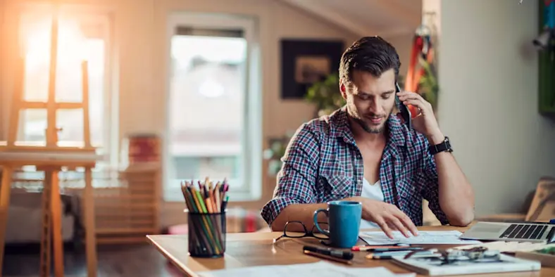 A man works from a home office.