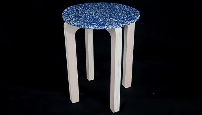 Furniture constructed with twice-recycled plastic