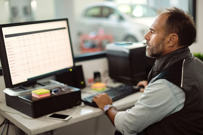 Man using computer while working in the office