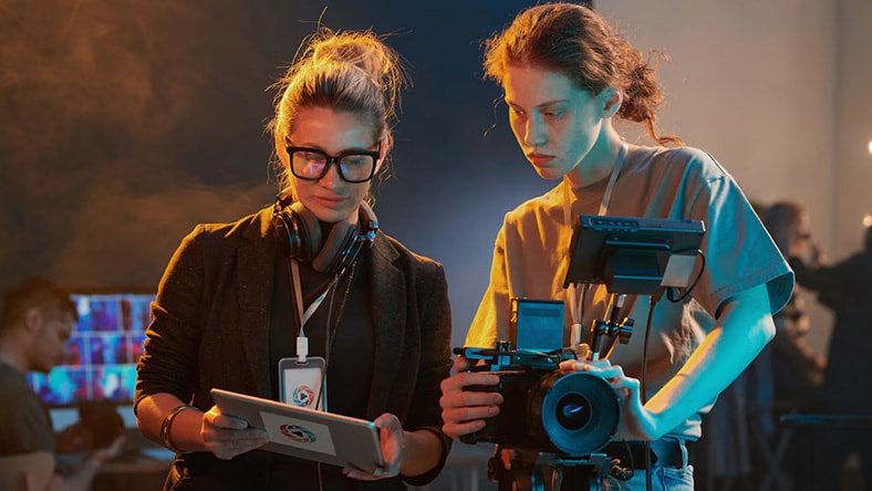 Filmmakers on-set reviewing footage