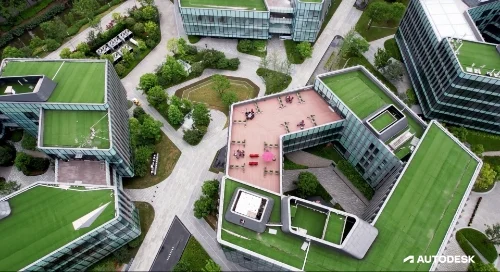 Aerial view of buildings with green roofs.