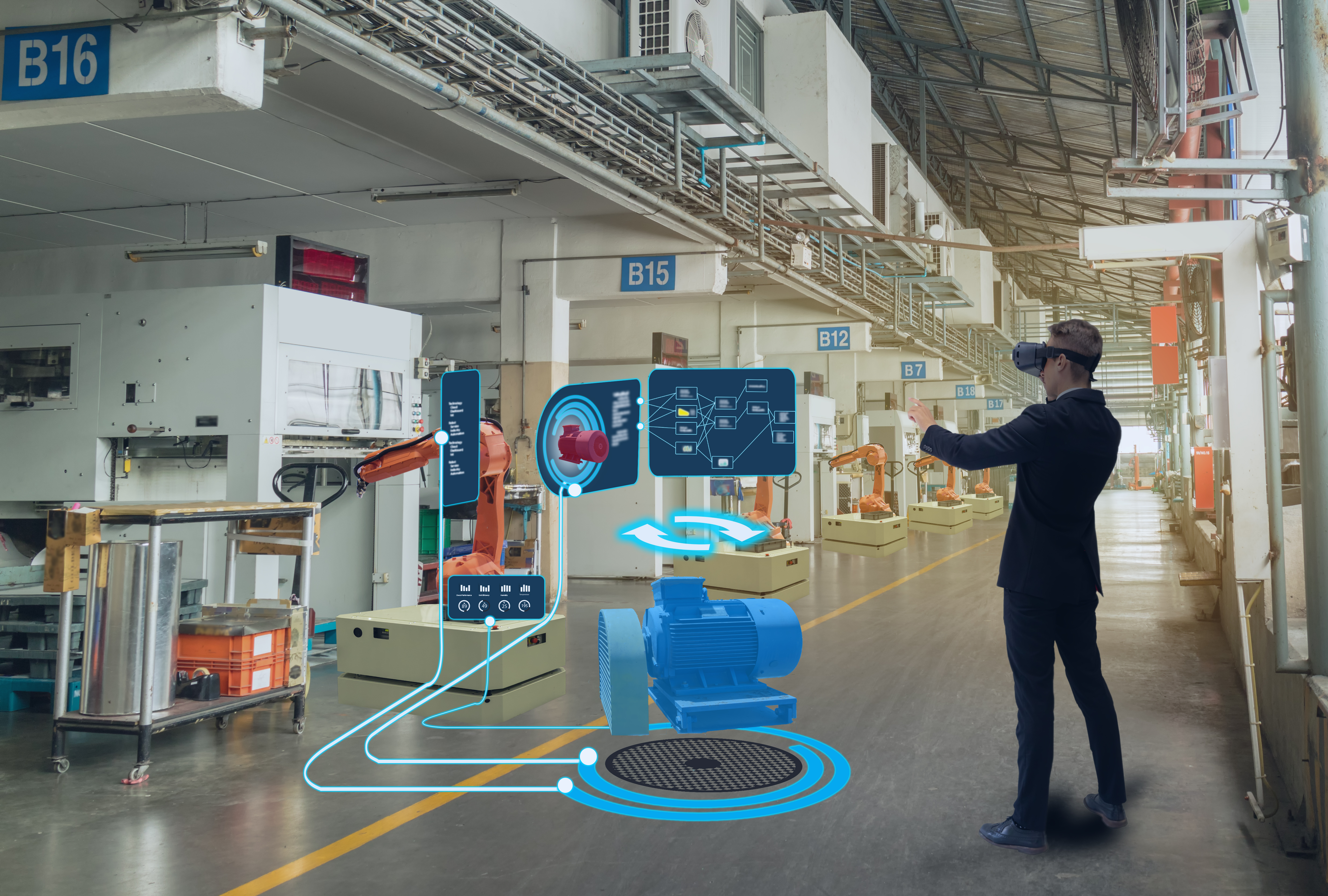 A man is using augmented reality glasses in a factory and interacting with a virtual interface displaying machine data and analytics.  