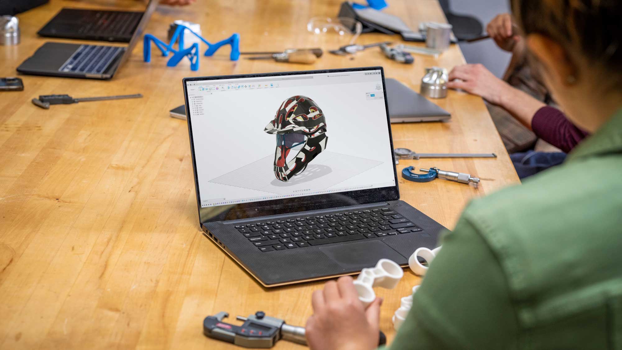 A rendering of a helmet is shown on a computer screen.