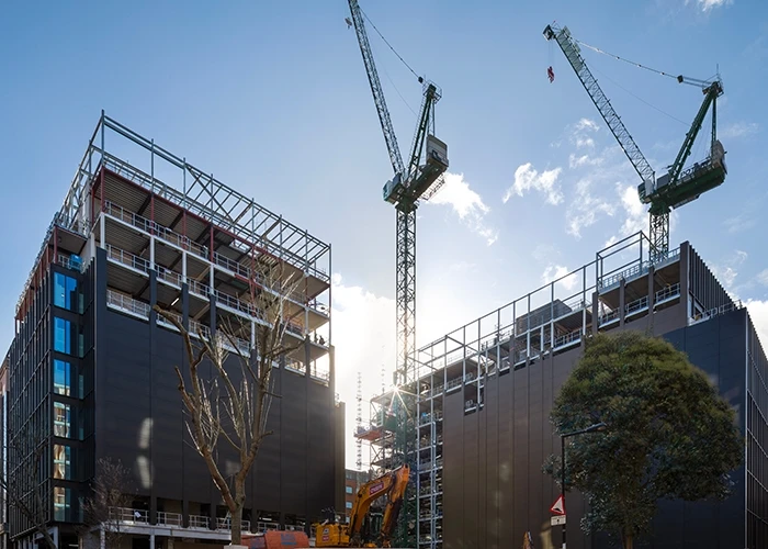 Cranes outside the Forge complex during construction