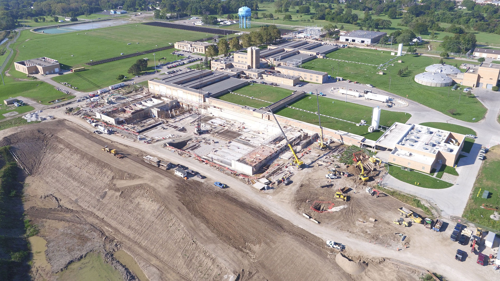 A high angle view of a waste water treatment plant undergoing water infrastructure renovation