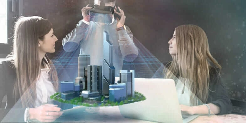 Drei Architekten um einen Tisch, einer davon trägt ein Virtual-Reality-Headset