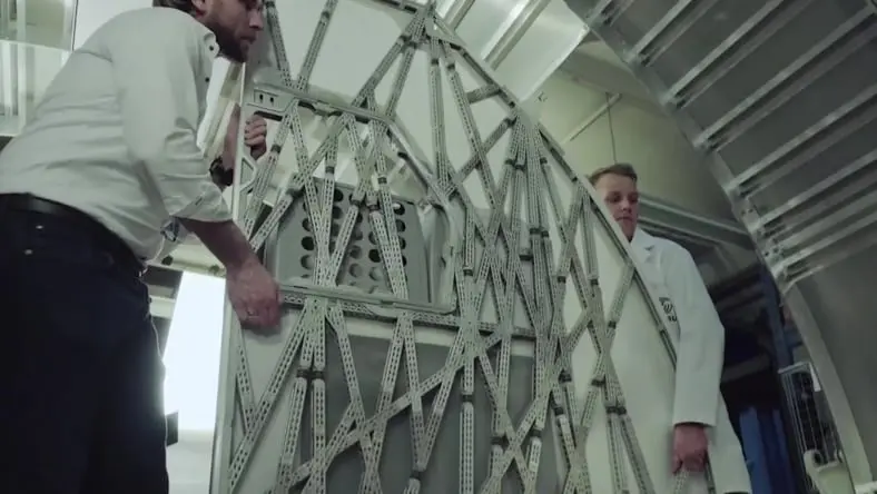 Engineers holding a bionic partition produced by Airbus