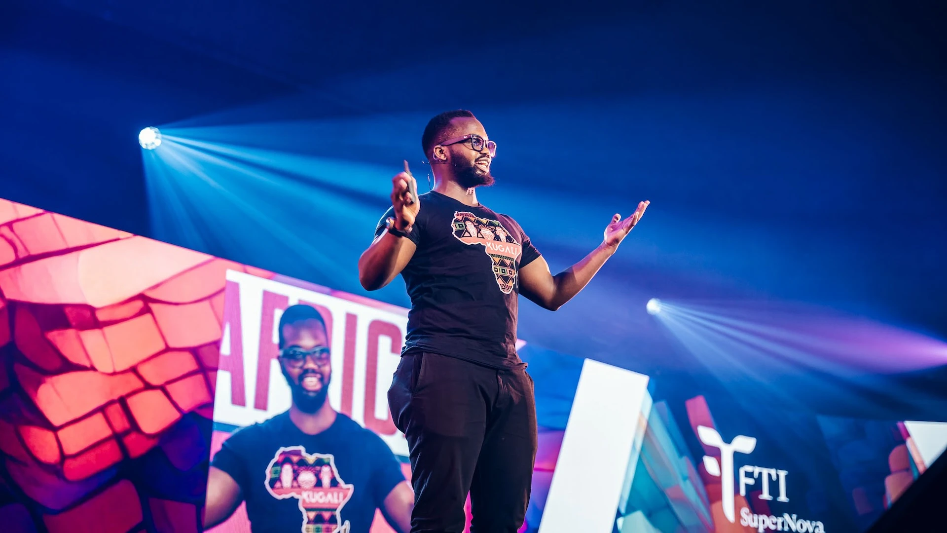 Hamid Ibrahim presents on stage at the FTI SuperNova Festival 2024 in Antwerp, Belgium.