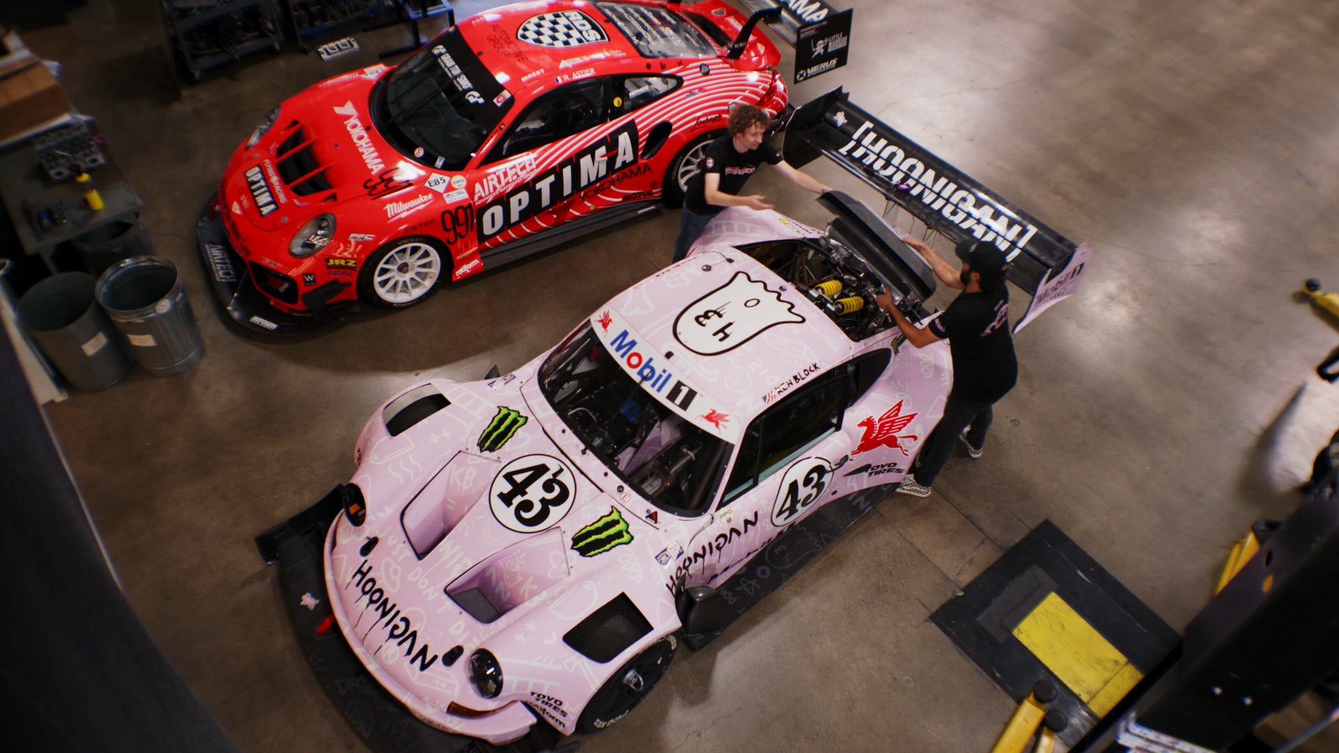 Aerial view of pink and red race cars built by BBI Autosport