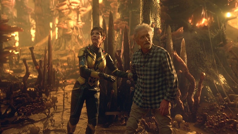 Characters from  Fantastic Forest sequence in Ant-Man and The Wasp: Quantumania explore a fantasy landscape.