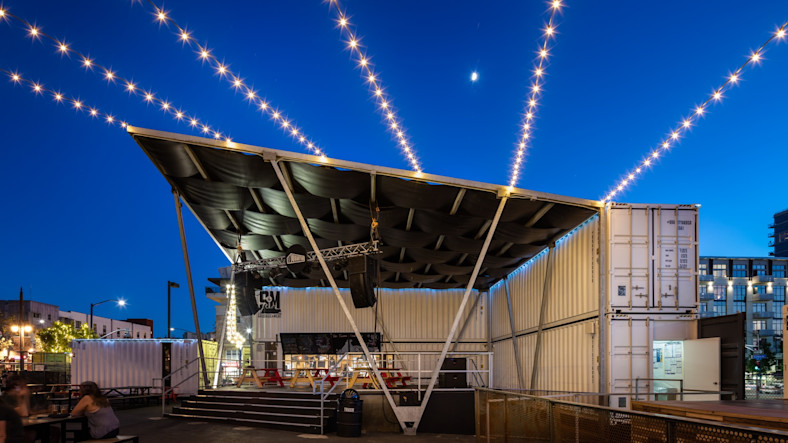 A view of the Quartyard stage at night shows the cargo containers that form the basis of the structure.
