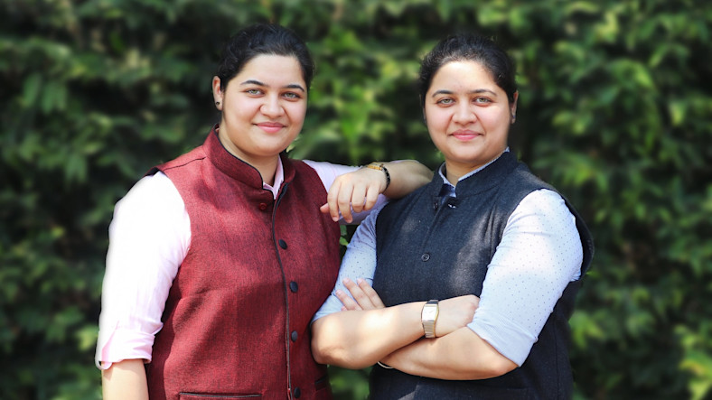 Nikita and Nishita Baliarsingh, identical twin sisters and founders of Nexus Power
