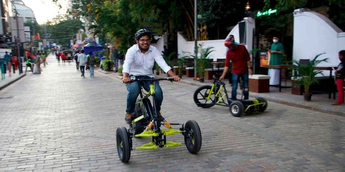 A man rides Greendzine’s Irrway NXP 500 “electric trike" in the street