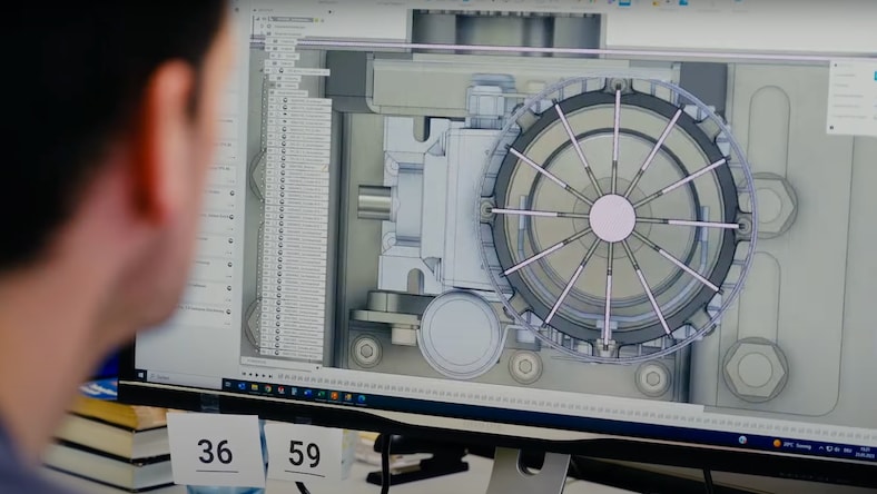 Close-up of a man viewing a screen in Fusion software.