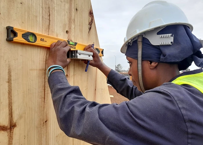 woman working in construction of Zima Homes