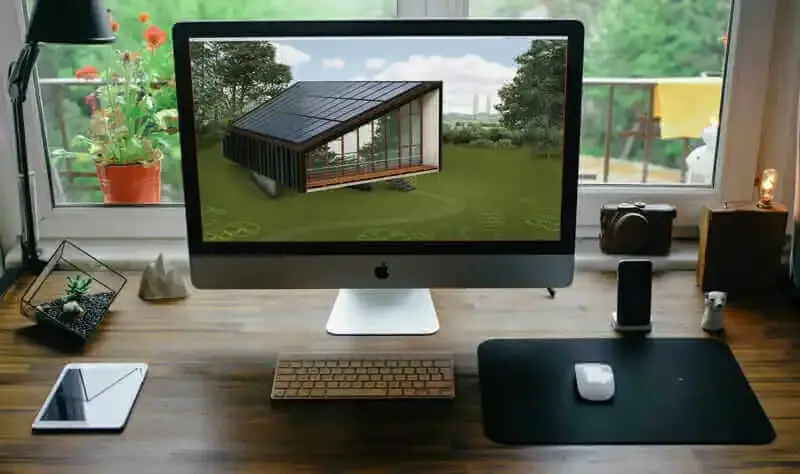 View of a desktop computer with an illustration of a sustainably designed home