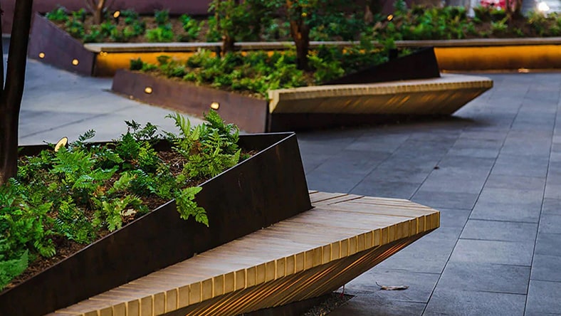 Sustainable landscape design of planters and benches in a unique space at Pinterest headquarters.
