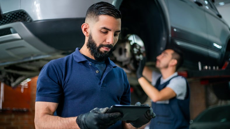 Man managing engineering changes in automotive industry.