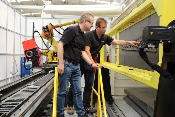 Messmer and Van der Zwaag look at the  LASIMM machine