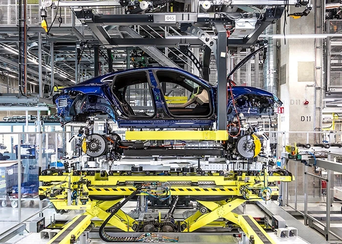 A Porsche Taycan coming together on the assembly line.