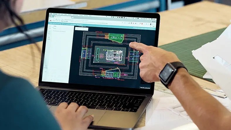 Architects working with AutoCAD to laser cut architectural models