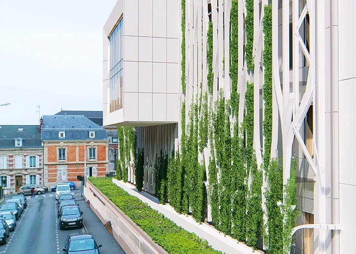 Exterior of an office building with a living wall