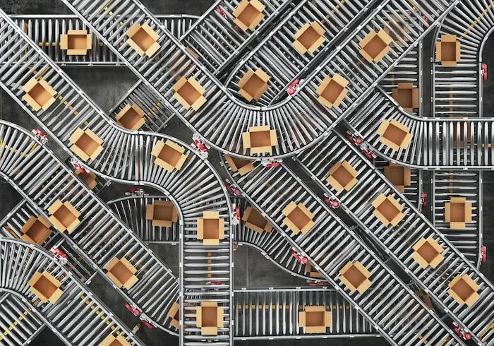 Boxes move along a factory production line.
