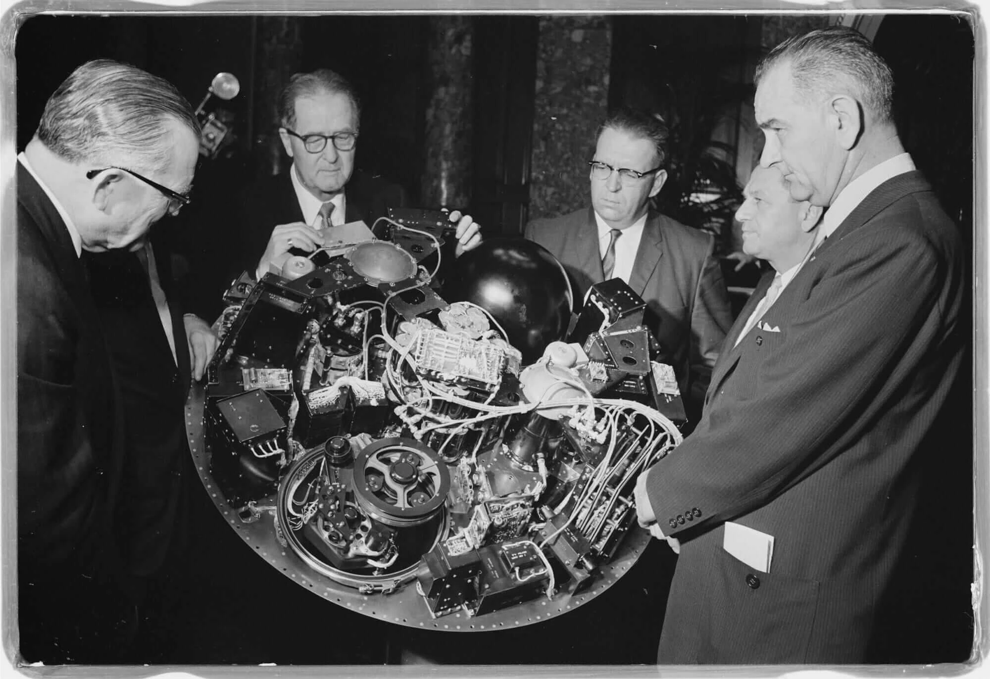 A showing of NASA's TIROS I satellite and its circuitry to Lyndon B. Johnson and U.S. senators on April 4, 1960. 