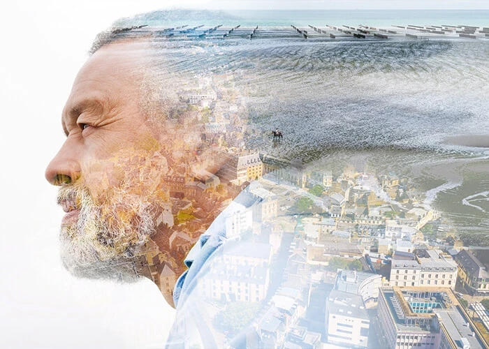 Composite image of the city of Saint-Brieuc Armor Agglomération and a man's face